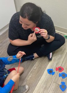 Staff working with child at Cutting Edge Therapy