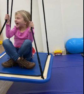 Girl on swing at Cutting Edge Therapy
