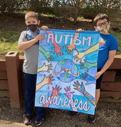 Gersh students holding autism poster